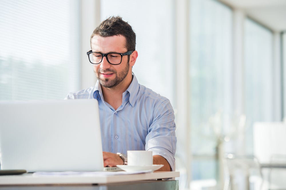 businessman at work with laptop in his office