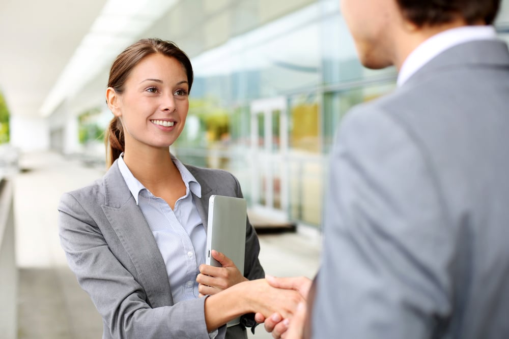 two business partners shaking hands, how to form a business partnership