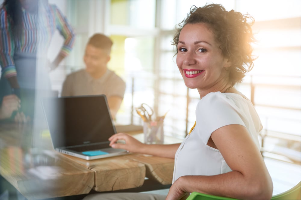 female business owner smiling in office 