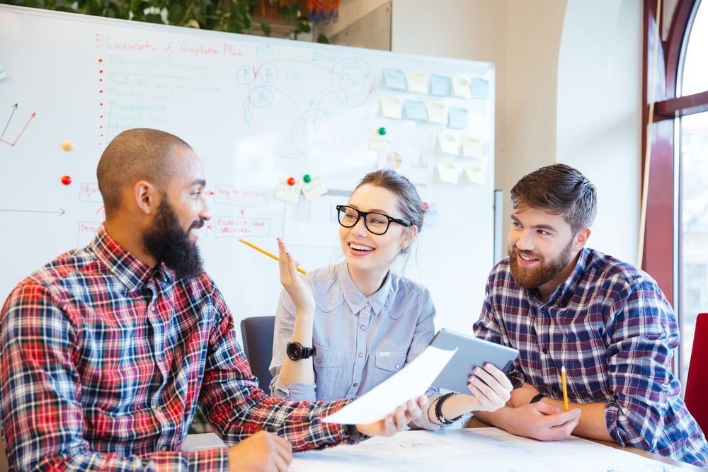 three business managers having a meeting, holiday checklist for small businesses