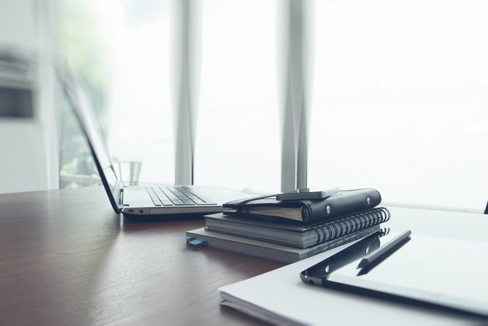 office workplace with laptop and smart phone on wood table