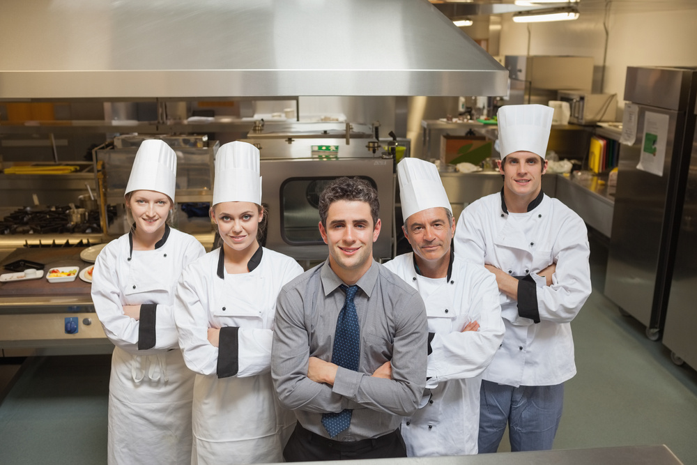 team of workers in a restaurant kitchen, benefits of equipment leasing