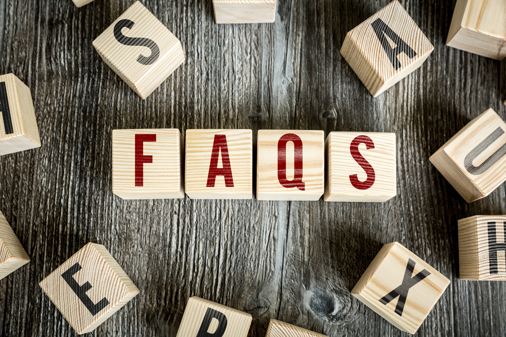 wood blocks with faq, company faq, frequently asked questions about huddle business capital