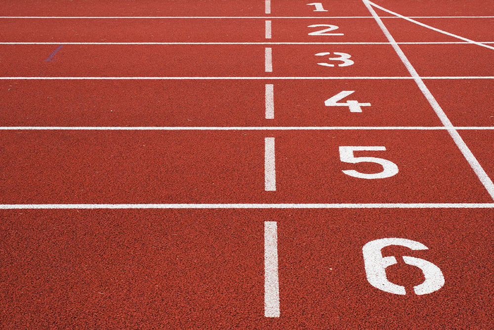 track and field finish line, about us, about huddle business capital