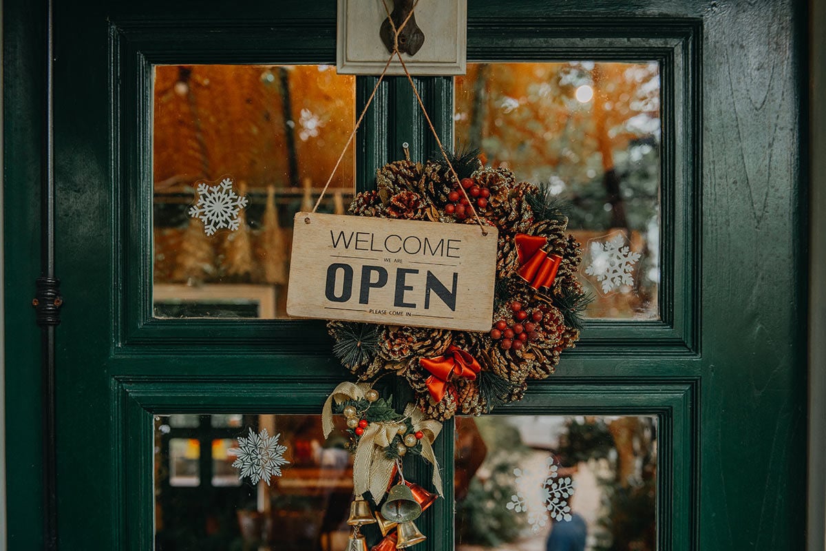 small business door with winter holiday decor, how to unwrap holiday success