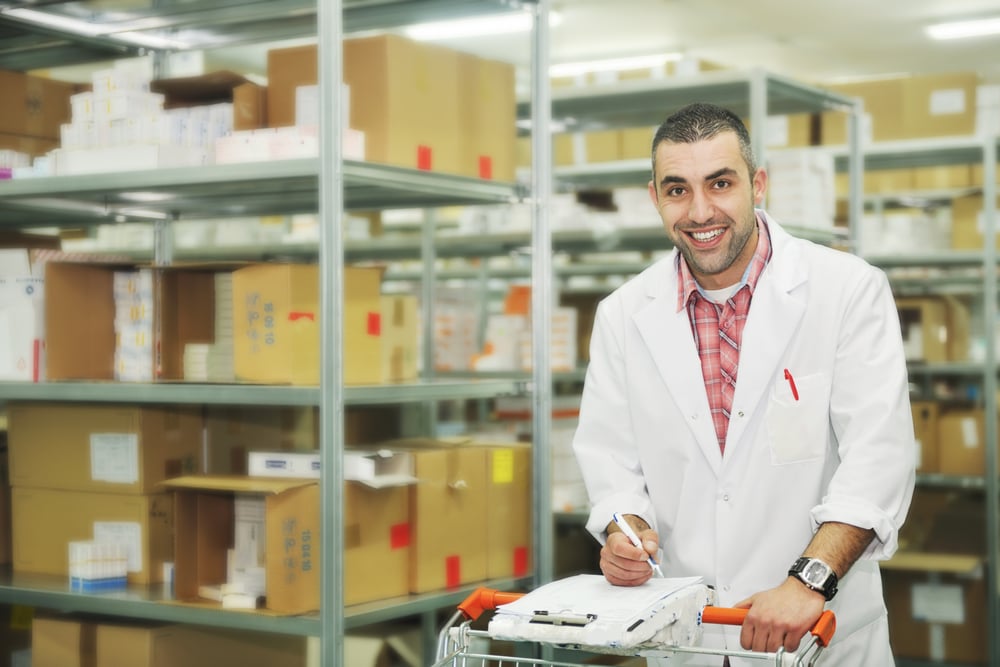 medical warehouse worker taking inventory in stockroom