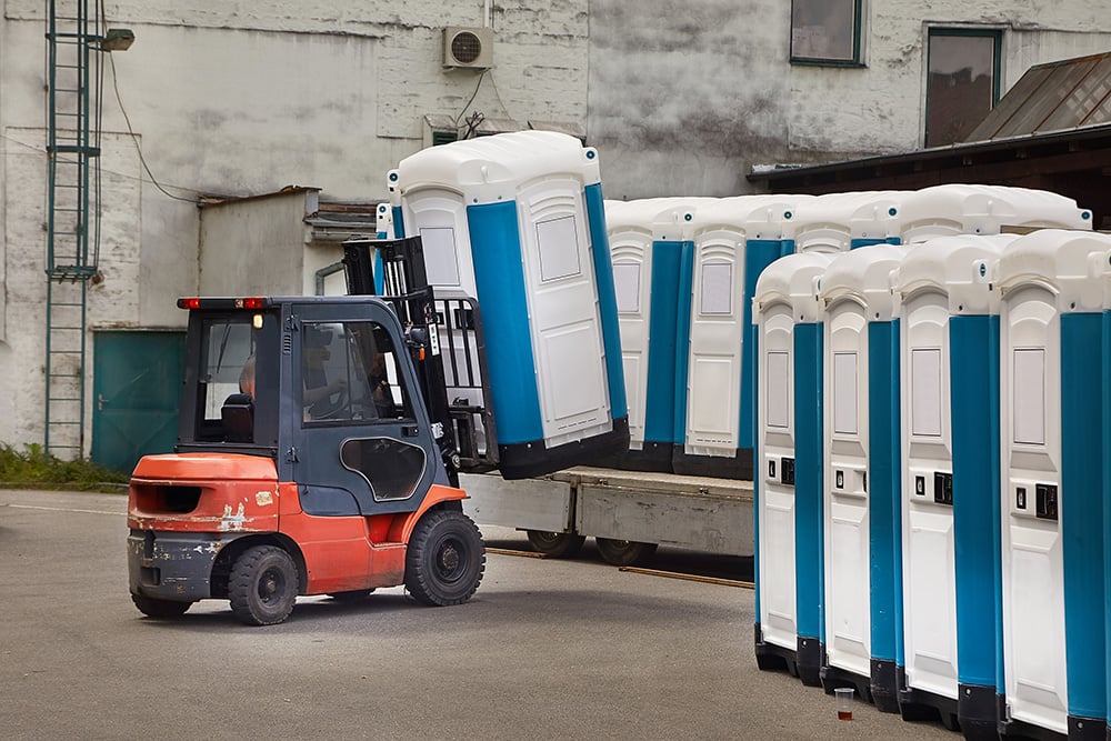 forklift moving portable sanitation equipment, portable sanitation equipment leasing