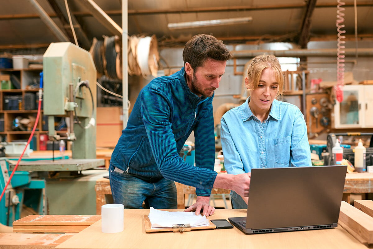 two woodworking business managers using computer, sba loan requirements