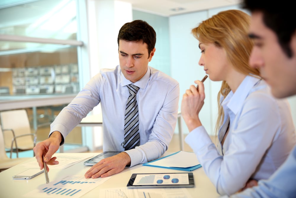 small business marketing team discussing a campaign, business marketing on a budget