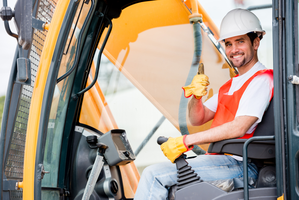 construction worker giving thumbs up while working, overview of equipment financing